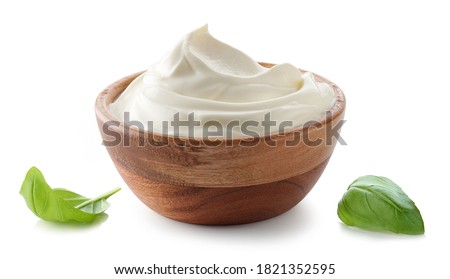 wooden bowl of whipped sour cream yogurt isolated on white background Royalty-Free Stock Photo #1821352595