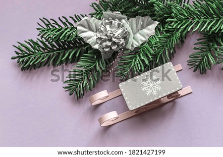 Christmas or New Year accessories on a colored background from above. Holidays, gifts, background, place for text.