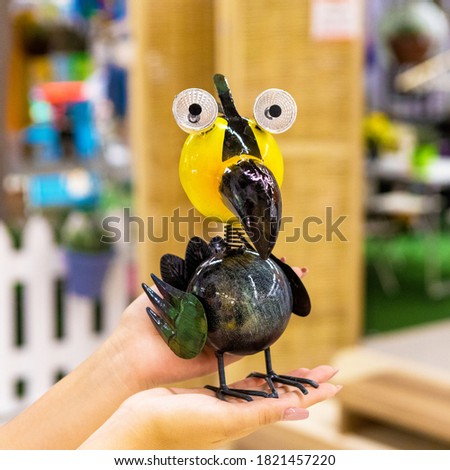 Toucans bird toy on the hand isolated