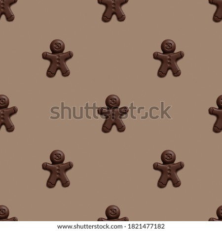 
Pattern Chocolate Christmas Gingerbread Man on light
brown background