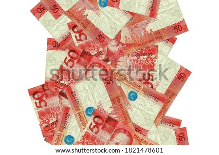 50 Philippine piso bills flying down isolated on white. Many banknotes falling with white copyspace on left and right side