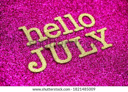 Hello July alphabet letters on pink glitter background