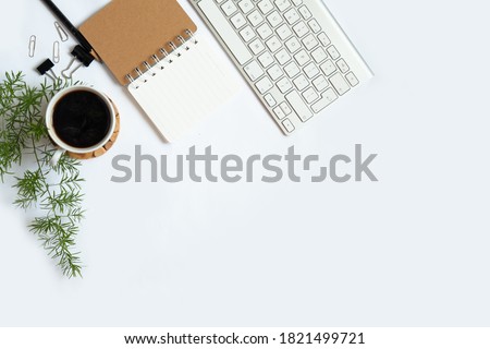 white office desk background with smartphone with blank screen mockup, laptop computer, cup of coffee and supplies. Top view with copy space, flat lay