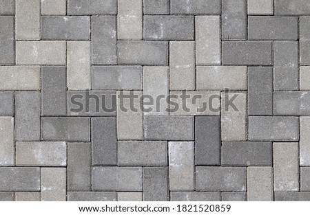 Seamless texture of street tiles. Pattern of gray sidewalk tiles