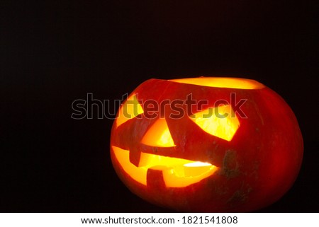 Glowing Halloween Pumpkin isolated on black background