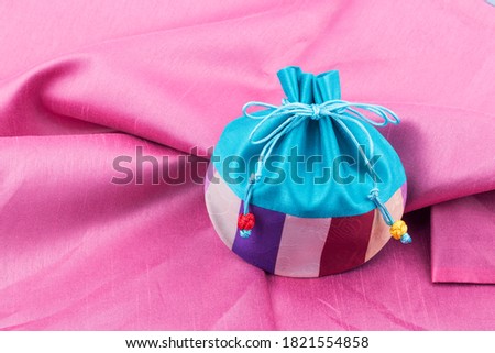 Korean lucky bag with traditional wrapping cloth. Royalty-Free Stock Photo #1821554858