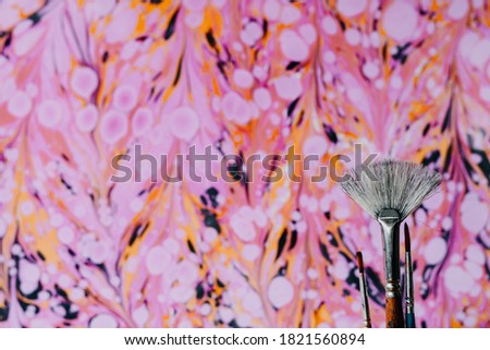 Modern Marbling. The marbling process involves floating acrylic paint on top of a base of thickened water, swirling and moving the paint into unique patterns. Abstract texture