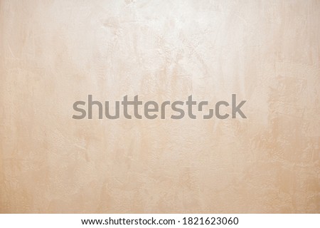 Wall decor Venetian decorative plaster with golden glitter paint. Background, abstraction. Apartment renovation concept. copy space Royalty-Free Stock Photo #1821623060