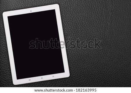 tablet pc over wood table with spoon and fork