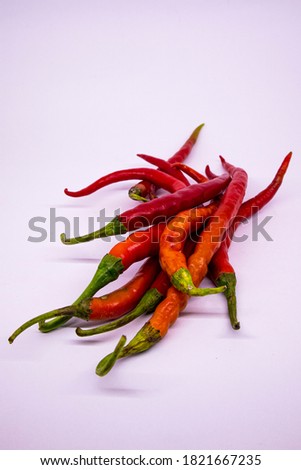 Image of fresh red chilies. Chili can be used as a spicy flavor enhancer in cooking / food. This image is perfect for a chili advertisement