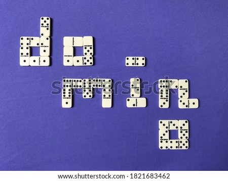 The Word "domino" Composed of Domino Tiles