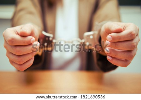 Teacher handcuffed, anti-graft concept at school Royalty-Free Stock Photo #1821690536