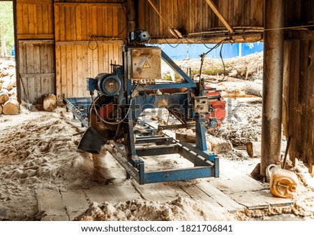 
woodworking machine in the barn and sawdust