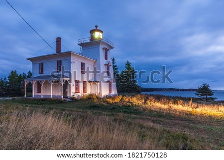Canada, Prince Edward Island, Rocky Point. Blockhouse Point Lighthouse at the entrance to Charlottetown Harbour. Royalty-Free Stock Photo #1821750128