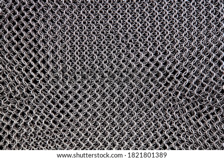 chain mail close up texture background. abstract iron ring backdrop. protection concept. Royalty-Free Stock Photo #1821801389