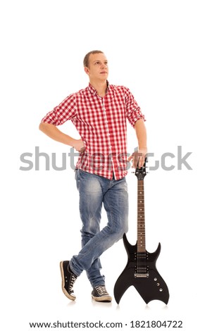Young, calm musician with electric guitar