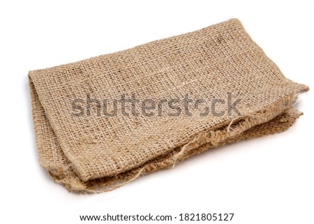 pieces of gunny sack against an isolated white background Royalty-Free Stock Photo #1821805127