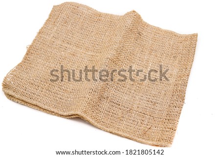pieces of gunny sack against an isolated white background Royalty-Free Stock Photo #1821805142