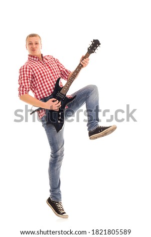 Young, crazy musician with electric guitar