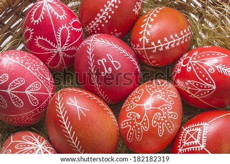 Red Easter eggs in a basket