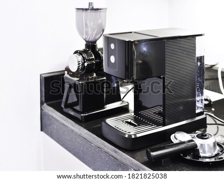 Coffee machine, coffee grinder Placed on the table  The picture is a factory product that produces coffee machines and various accessories for the beverage-making operations that are sold to cafes, co