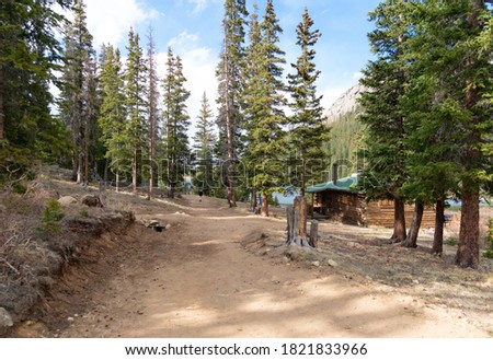 A log cabin in the forest of the Rocky Mountains in Colorado