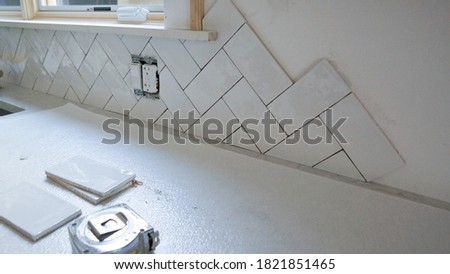 Backsplash tile project in the kitchen Royalty-Free Stock Photo #1821851465