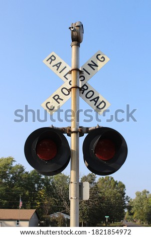 a railroad crossing sign on railway