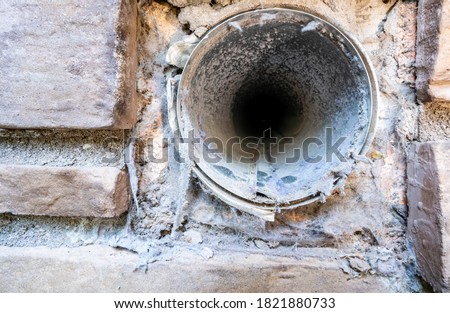 Interior view of dryer vent line with lint and dust buildup
 Royalty-Free Stock Photo #1821880733