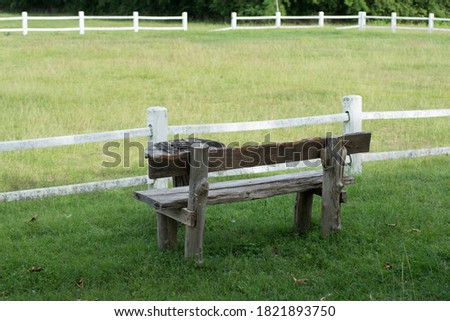 A wooden chair in the grass