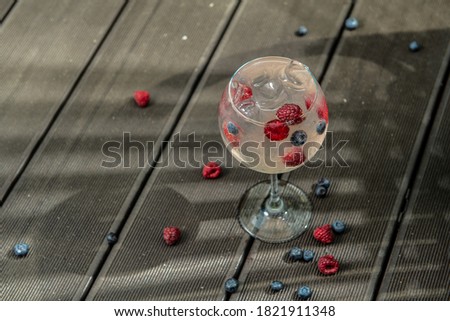 cocktail with berries and ice