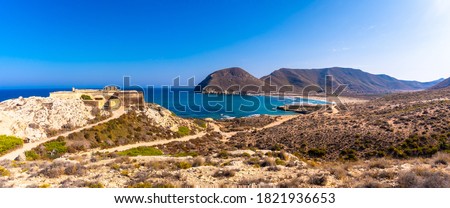 Panoramic of the coast and the castle of Playazo de Rodalquilar in the natural park of Cabo de Gata, Nijar, Andalucia. Spain, Mediterranean Sea Royalty-Free Stock Photo #1821936653