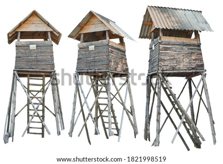 Watchtower isolated on a white background. Mockup for design. Wooden tower for hunting and observation. The tower from different angles. Royalty-Free Stock Photo #1821998519
