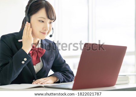 Asian female high school student taking online class. Royalty-Free Stock Photo #1822021787