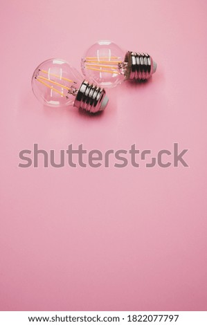 A vertical shot of incandescent light bulbs