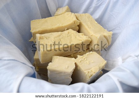 Freshly handmade natural soap put to dry in a bucket covered with fabrics Royalty-Free Stock Photo #1822122191