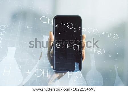 Creative chemistry concept and hand with phone on background. Multiexposure