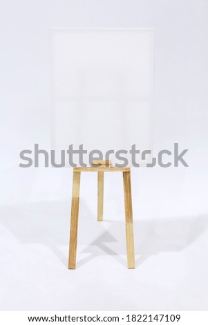 Canvas frame blank for mockup on wooden easel. Creative for paint drawing of artist concept. With clipping path.