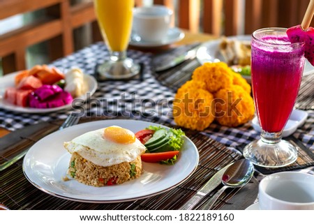 Indonesian Breakfast Fried Rice with Egg and Juice