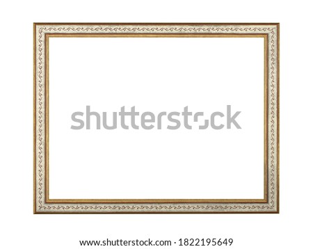 Old empty brown wooden frame for paintings with gold patina. Isolated on white background