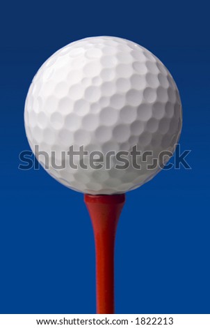 Golf ball(s) on tee in studio. Isolated from background colors.