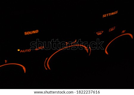 Illuminated radio and air conditioning control in the car in the dark