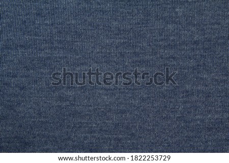 Pattern with grey knitted wool fabric for clothing design. Colorful abstract seamless pattern. Gray background.