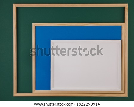 Images with space for text.Photo frame.Wooden frame.Frame.Board for recording.Colored background of geometric shapes.Color.
