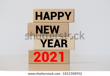 Word HAPPY NEW YEAR 2021 made from wooden cubes with decoration for Chistmas. Banner, backdrop