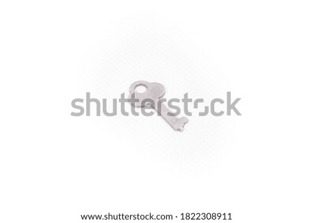 small silver key isolated on white background.