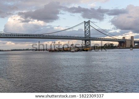 The iconic ben franklin bridge over the delaware river to new jersey river