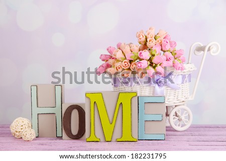 Composition with decorative letters on table on bright background