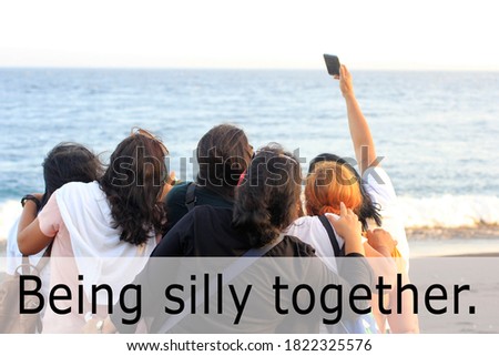 Friendship Inspirational words - Being silly together. On people back background of taking selfie in a vacation on the beach. Having fun together as family sisters concept.