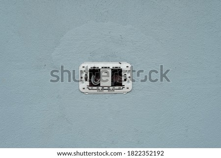 Sockets embedded in a cement wall